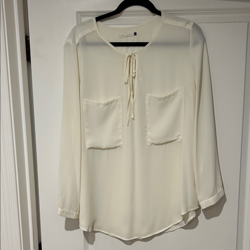 Chic Cream Blouse with Front Pockets